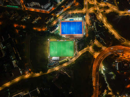 Aerial birdâs eye view of the outdoor hockey field at night. The image contains soft-focus, grain, and noise.のeditorial素材