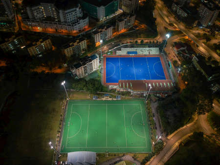 Aerial birdâs eye view of the outdoor hockey field at night. The image contains soft-focus, grain, and noise.のeditorial素材