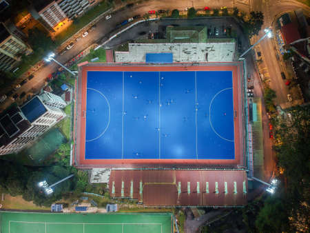Aerial birdâs eye view of the outdoor hockey field at night. The image contains soft-focus, grain, and noise.のeditorial素材