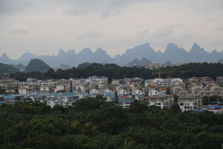 Buildings and Mountains in Guilin, Chinaの写真素材