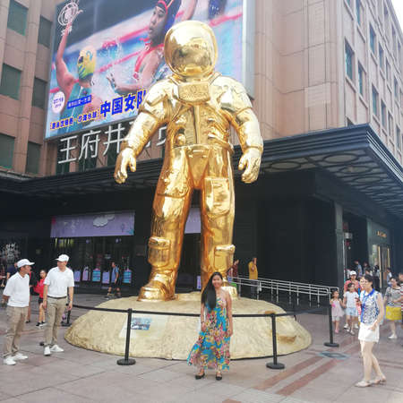 Giant Golden Astronaut Statue in Beijing, Chinaのeditorial素材
