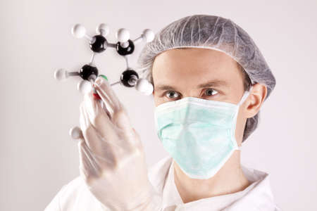 Scientist Holding Atoms