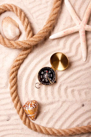 Compass and sand の写真素材