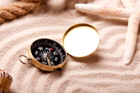 Compass and sand の写真素材
