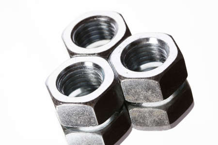 Steel Nuts on mirrorの写真素材