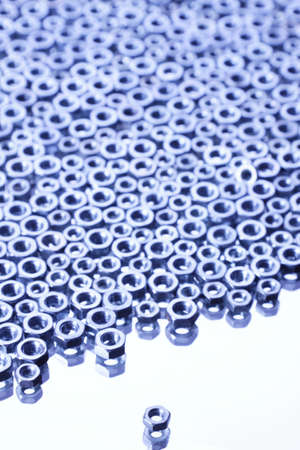Steel Nuts on mirrorの写真素材