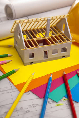 Construction plans and blueprints on wooden tableの写真素材