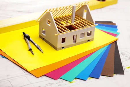 Construction plans with helmet and drawing tools on blueprintsの写真素材