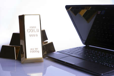 Gold bar and Computer Keyboard for background の写真素材