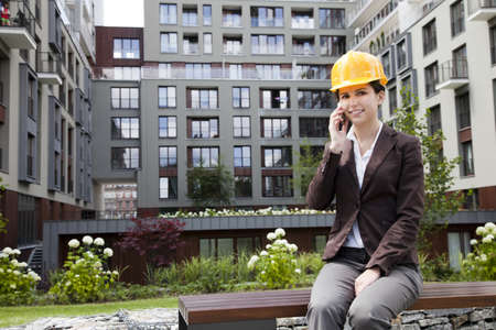 Female construction engineer and yellow helmetの写真素材