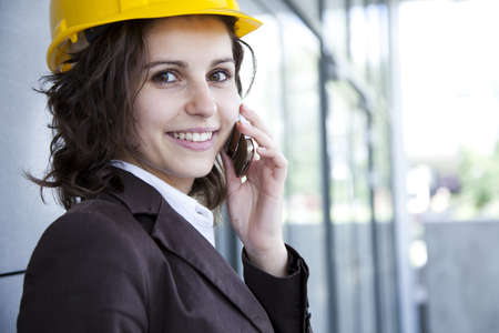 Female construction engineer and yellow helmetの写真素材