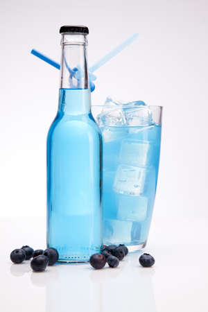 Exotic bottle alcohol cocktail isolated on whiteの写真素材