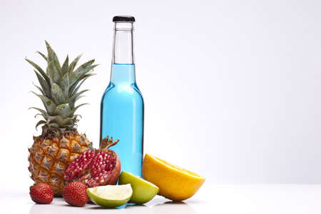 Exotic alcohol drinks set with fruits isolated on white backgroundの写真素材
