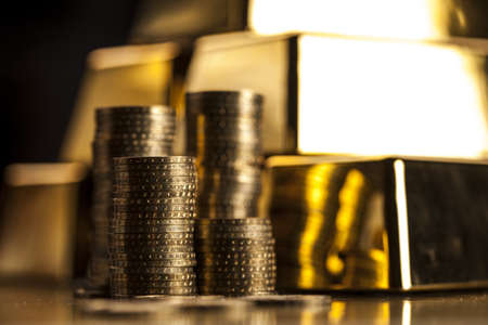 Gold bars and golden coins  Financial concept