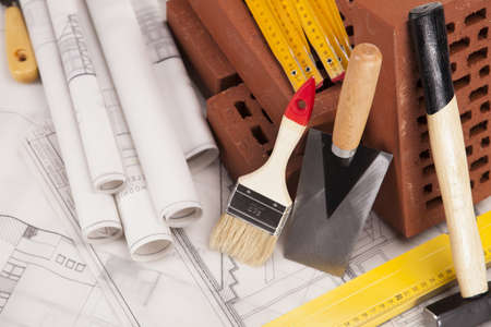 Building and construction equipment on blueprintsの写真素材