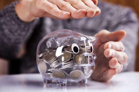 Man holding piggy bank 