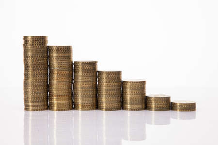 Lot of money  coins isolated on white backgroundの写真素材