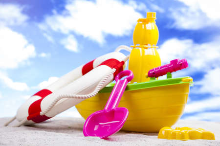 Fun on the beach with a lot of toys の写真素材