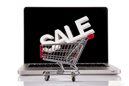Computer, basket and free web shopingの写真素材