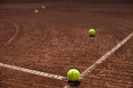 Tennis ball in the corner of the courtの写真素材