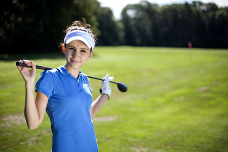 Portrait of a woman playing golf in summerの写真素材