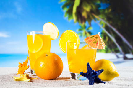 Tropical drinks on beach and sunの写真素材
