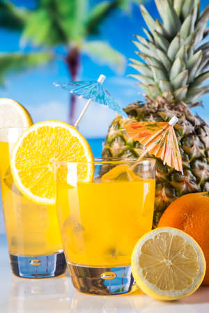 Tropical drinks on beach and sunの写真素材