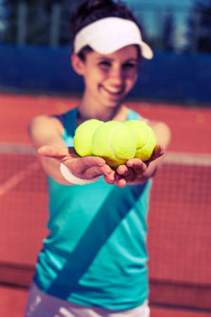 Female playing tennis on courtの写真素材