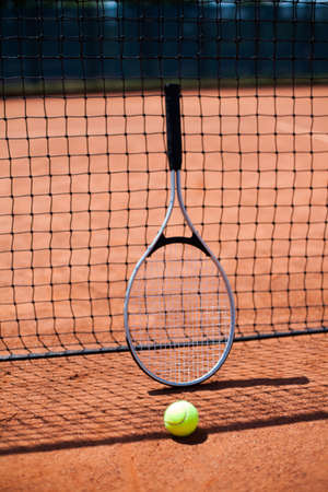 Female playing tennis on courtの写真素材