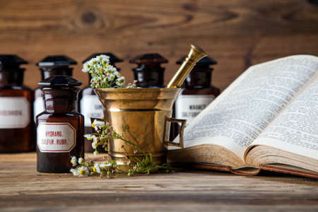 The ancient natural medicine, herbs,  medicines and old bookの写真素材