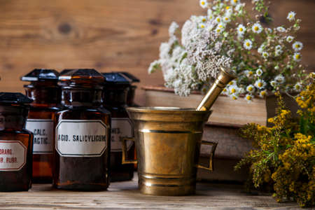 The ancient natural medicine, herbs,  medicines and old bookの写真素材