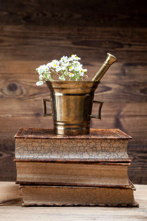 The ancient natural medicine, herbs,  medicines and old bookの写真素材