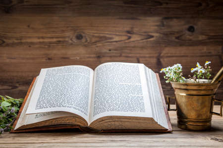 The ancient natural medicine, herbs,  medicines and old bookの写真素材