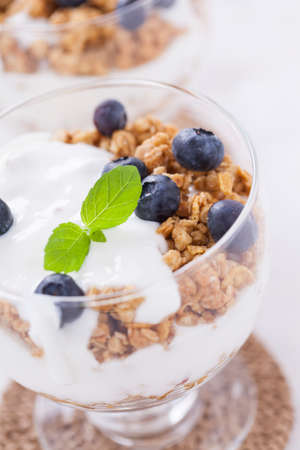Delicious dessert with fruits and flakes on a wooden table. Studio shotの写真素材