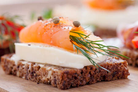 Delicious little sandwiches with tuna, cheese, prosciutto and vegetables. Zoom and macro shots made dSLR cameraの写真素材