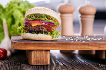 Beef burgers on a wooden board with aromatic spices. Studio Shotの写真素材