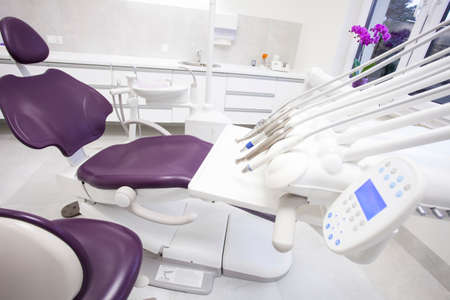 Modern dental practice. Dental chair and other accessories used by dentists.の写真素材