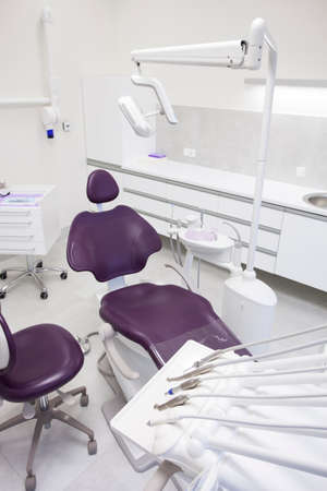 Modern dental practice. Dental chair and other accessories used by dentists.の写真素材