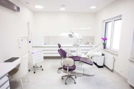 Modern dental practice. Dental chair and other accessories used by dentists.の写真素材