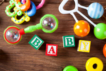 Children's World toy on a wooden background. Studio shot]の写真素材