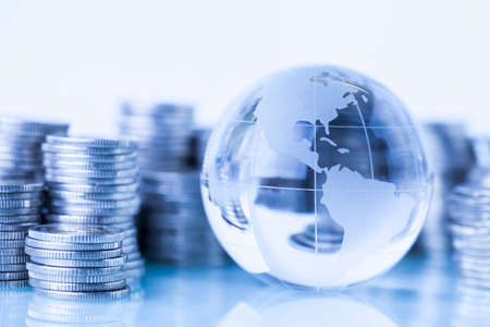 Concept of money around the world on white backgroundの写真素材