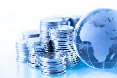 Concept of money around the world on white backgroundの写真素材