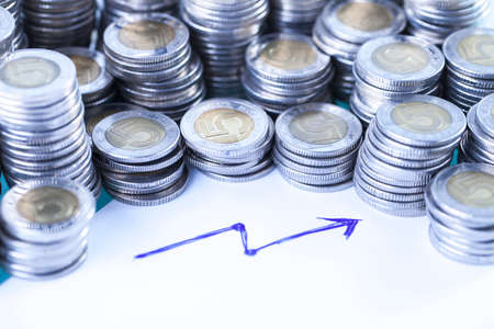 Financial concept with money and arrow on white backgroundの写真素材