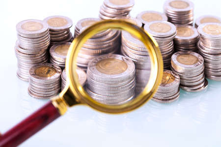 Money under loupe. Zoom on home finances. Studio shotの写真素材
