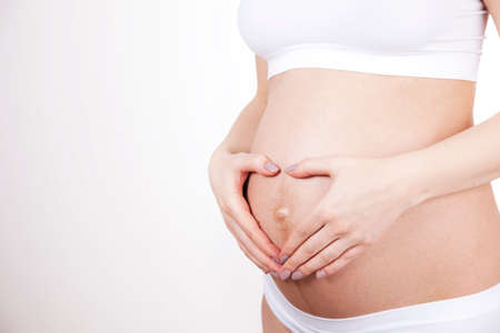 Young and beautiful mom waiting for the babyの写真素材