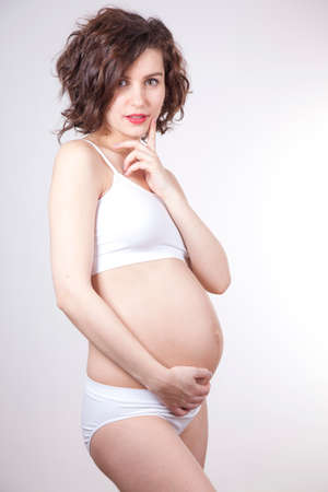 Young and beautiful mom waiting for the babyの写真素材