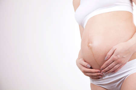 Young and beautiful mom waiting for the babyの写真素材