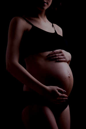 Young and beautiful mom waiting for the babyの写真素材