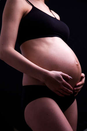 Young and beautiful mom waiting for the babyの写真素材