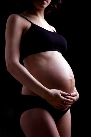 Young and beautiful mom waiting for the babyの写真素材